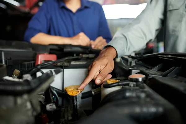 Explaining Client What Car Parts He Fixed